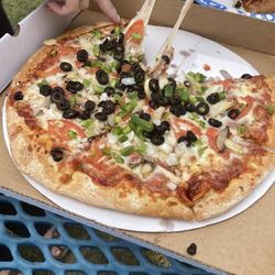 Al's Pizza - Veggie pizza with cheese pull.