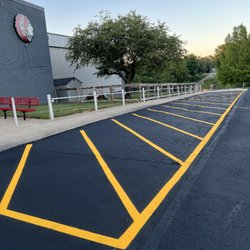 Royal Contracting - school parking from gravel built up to a permanent asphalt an parking lines from scratch we are always fair an workmanship like here
