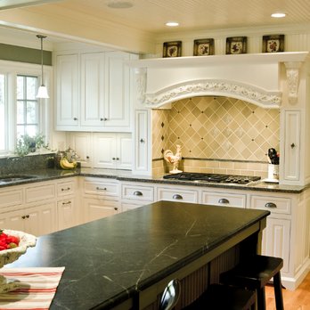 White's Construction - a kitchen with black countertops - General Contractors Near Me White's Construction - a kitchen with black countertops - General Contractors Near Me