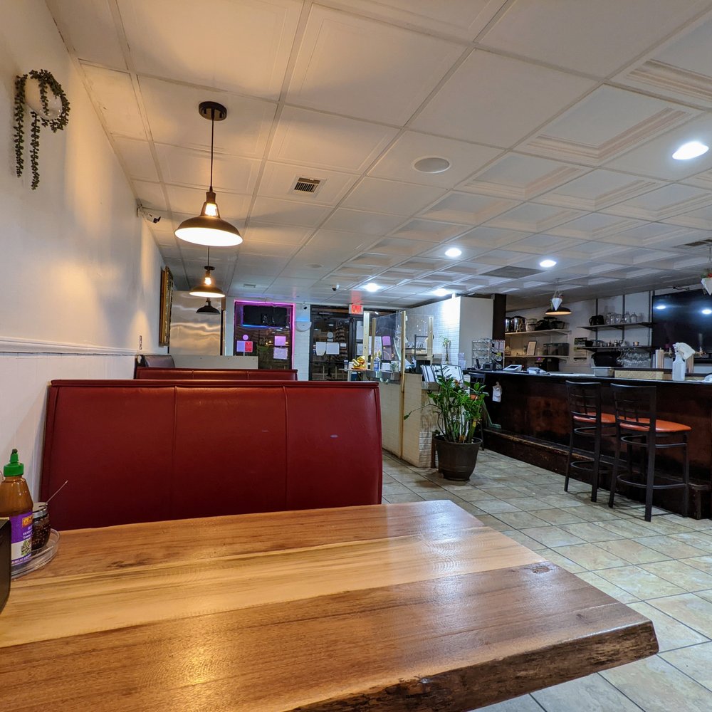 Pho Happiness - Inside. Sitting at a middle booth, facing the front of the house and bar. - Vietnamese Near Me - Chapel Hill, North Carolina Pho Happiness - Inside. Sitting at a middle booth, facing the front of the house and bar. - Vietnamese Near Me - Chapel Hill, North Carolina