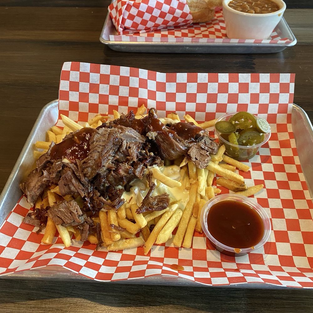 Brisket fries with cheese sauce, jalapeños, and BBQ sauce. It came with a good sized portion of brisket too!