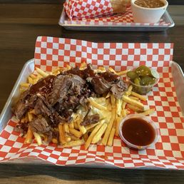 Brisket fries with cheese sauce, jalapeños, and BBQ sauce. It came with a good sized portion of brisket too! Brisket fries with cheese sauce, jalapeños, and BBQ sauce. It came with a good sized portion of brisket too!