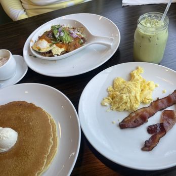 Broken Yolk Cafe - Short stack, bacon and 2 Eggs and Iced Matcha Green Tea Latte (background: Ranchero skillet) - Breakfast & Brunch Near Me - Fullerton, California Broken Yolk Cafe - Short stack, bacon and 2 Eggs and Iced Matcha Green Tea Latte (background: Ranchero skillet) - Breakfast & Brunch Near Me - Fullerton, California