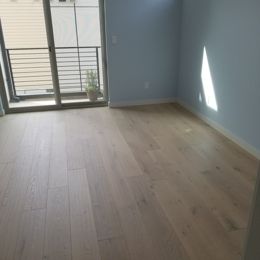 Andy's 5 Star Flooring - a hardwood floor in a living room - Flooring Near Me - Seattle, Washington Andy's 5 Star Flooring - a hardwood floor in a living room - Flooring Near Me - Seattle, Washington