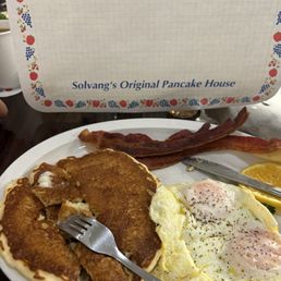 Buttermilk pancakes, over easy eggs and crispy bacon Buttermilk pancakes, over easy eggs and crispy bacon