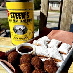 Johnson's Boucanière - Boucaniere Board - 6 mini beignets and 6 mini boudin balls.  Served with Steen's Syrup on the side. Available on Sundays from 10AM-2PM