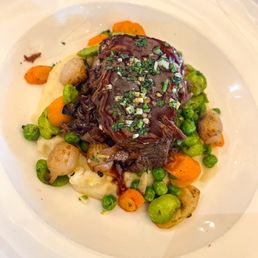 Red wine braised short ribs with baby vegetable ragout, horseradish potato puree, red wine jus, preserved lemon gremolata Red wine braised short ribs with baby vegetable ragout, horseradish potato puree, red wine jus, preserved lemon gremolata