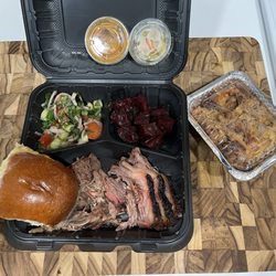 2x2 platter with Prime Brisket, Pulled Lamb Shoulder, Smoked Beets, Israeli Salad. Apple Bread Pudding