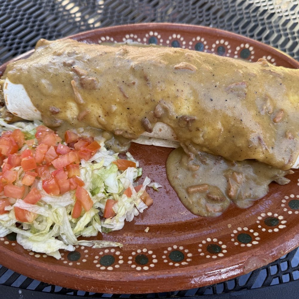 Flora Cafe - A.M. Burro Grande with asada (steak) smothered in green chile - Cafes Near Me - Omaha, Nebraska Flora Cafe - A.M. Burro Grande with asada (steak) smothered in green chile - Cafes Near Me - Omaha, Nebraska