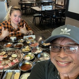 date night couple enjoying sum K-BBQ and Sojuuuu date night couple enjoying sum K-BBQ and Sojuuuu