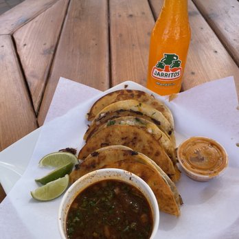 SOPA - a plate of mexican food and a bottle of orange juice - Food Trucks Near Me - Bend, Oregon