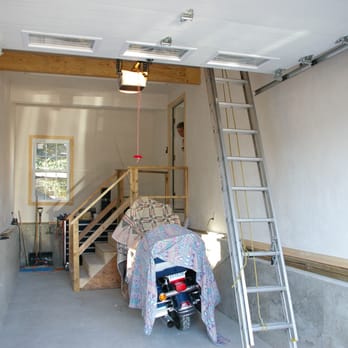 Colony Home Improvement - a garage with a ladder and ladders - General Contractors Near Me - Needham, Massachusetts