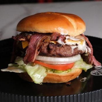 Juicy Joint - Halal beef smash burger with crispy bacon, melted cheese, and fresh toppings - Juicy Joint signature burger. - Burgers Near Me - Dallas, Texas Juicy Joint - Halal beef smash burger with crispy bacon, melted cheese, and fresh toppings - Juicy Joint signature burger. - Burgers Near Me - Dallas, Texas