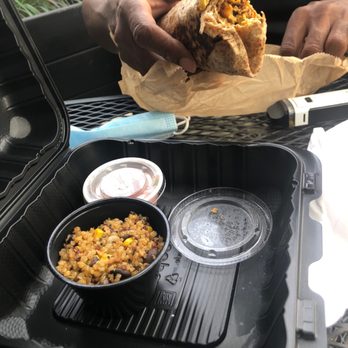 Redbird Cafe - a man eating a burrito - Breakfast & Brunch Near Me - Homewood, Illinois