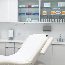 Atlantic Center For Plastic and Cosmetic Surgery - Spa Room 1. We have in room retail available for purchase after your treatments.