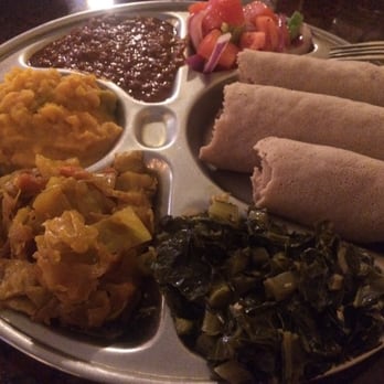 Elephant Walk - Veggie combo #3.  This is supposed to serve 1 person, but it's a LOT of food.    Delicious cabbage, collard greens, etc. - Ethiopian Near Me - Cincinnati, Ohio