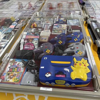 TCG Trainers Universe - An example of one of our product cases. This case showcases a special Pikachu Nintendo 64.
Products shown may not be available. - Tabletop Games Near Me - Franklin, Massachusetts TCG Trainers Universe - An example of one of our product cases. This case showcases a special Pikachu Nintendo 64.
Products shown may not be available. - Tabletop Games Near Me - Franklin, Massachusetts