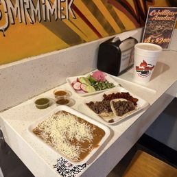 Tacos and beans with sides from salsa bar