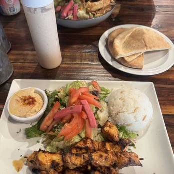 Sultan's Kebab - Chicken kebab plate, combination, Shawarma salad in the background. - Mediterranean Near Me - Livermore, California Sultan's Kebab - Chicken kebab plate, combination, Shawarma salad in the background. - Mediterranean Near Me - Livermore, California