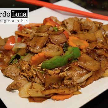 Sap Sap Lao Cafe - a plate of food with chopsticks - Laotian Near Me - Pinellas Park, Florida Sap Sap Lao Cafe - a plate of food with chopsticks - Laotian Near Me - Pinellas Park, Florida