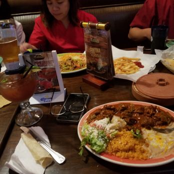 Los Tres Hermanos - Spicy pork. In the background theres fries and bistec ranchero (dont mind my spelling) - Mexican Near Me - Van Nuys, California Los Tres Hermanos - Spicy pork. In the background theres fries and bistec ranchero (dont mind my spelling) - Mexican Near Me - Van Nuys, California