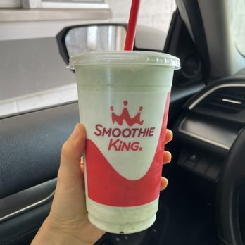 Smoothie King - a hand holding a cup of smoothie - Juice Bars & Smoothies Near Me - Champaign, Illinois