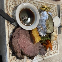 The Ivy House Restaurant - Prime Rib, corn bread, carrots, green beans, baked potato and roll.
