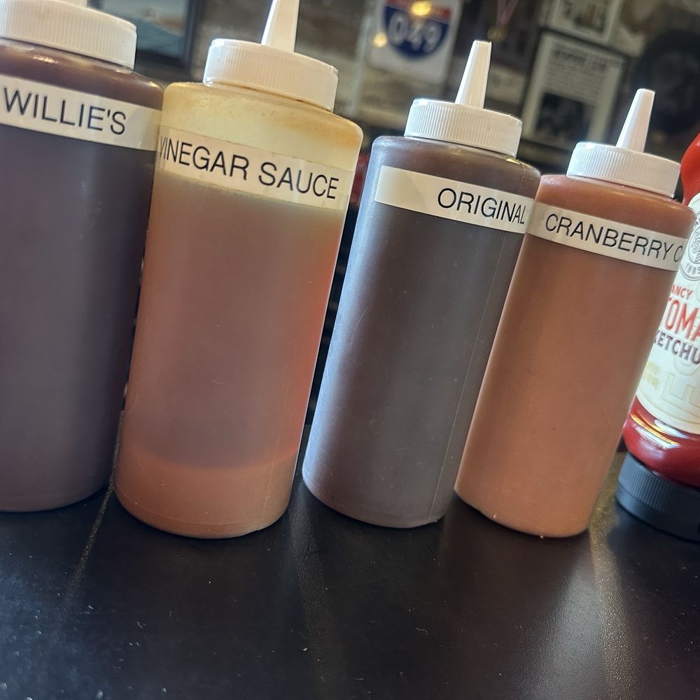 Que 49 Smokehouse - Sauces - Hot Willie's, Vinegar Sauce, Original, and Cranberry Cayenne. - Barbeque Near Me - Jonesboro, Arkansas Que 49 Smokehouse - Sauces - Hot Willie's, Vinegar Sauce, Original, and Cranberry Cayenne. - Barbeque Near Me - Jonesboro, Arkansas