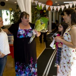 1st Driving Excellence - Kathlyn holds flowers received from a driving school graduate.
