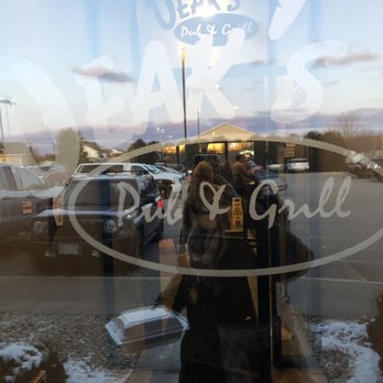 Deak's Pub and Grill - a reflection in the window - American Near Me - Stoughton, Wisconsin