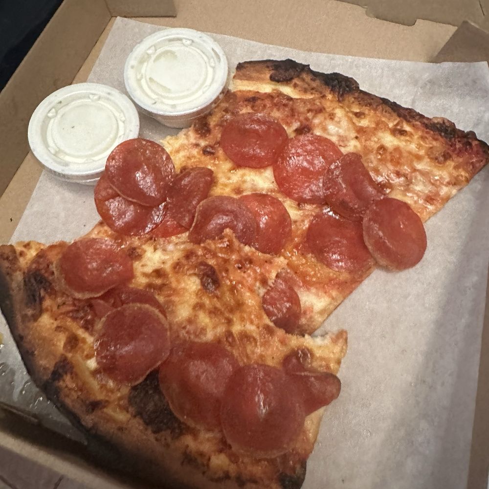 Burnt crust burnt cheese on a New York slice smh can't even get that right! Fix your oven please Burnt crust burnt cheese on a New York slice smh can't even get that right! Fix your oven please