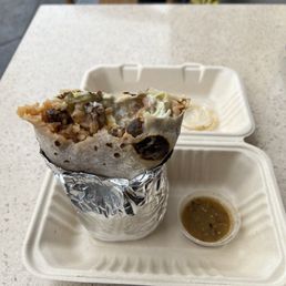 Burrito carnitas + guacamole + sour cream, and no onions.Size container about an American football, and the burrito almost the same. 5/5
