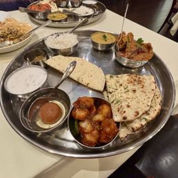 Lunch thali: Chicken Chettinadu (top right highly recco), the crispy cauliflower in front & Garlic Naan also fantastic. Lunch thali: Chicken Chettinadu (top right highly recco), the crispy cauliflower in front & Garlic Naan also fantastic.