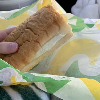 Subway - a hand holding a sandwich wrapped in paper - Sandwiches Near Me - Grove City, Pennsylvania Subway - a hand holding a sandwich wrapped in paper - Sandwiches Near Me - Grove City, Pennsylvania