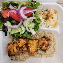 Chicken kabob plate... Brown rice portion was enough to cover the bottom of the tray... The hummus was a poor portion... Chicken kabob plate... Brown rice portion was enough to cover the bottom of the tray... The hummus was a poor portion...