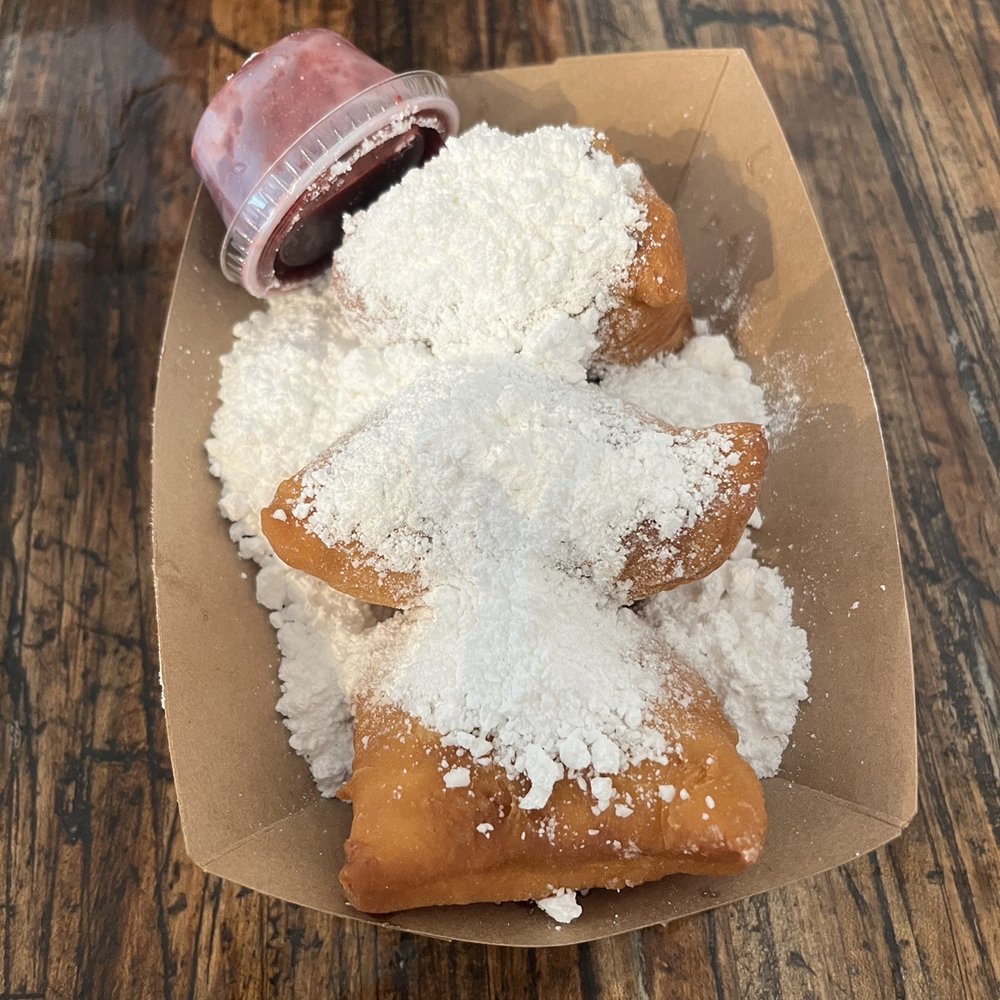 Mo'Bay Beignet - 3 count with blackberry sauce - Coffee & Tea Near Me - Mobile, Alabama Mo'Bay Beignet - 3 count with blackberry sauce - Coffee & Tea Near Me - Mobile, Alabama