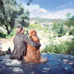 Invisible Fence Brand by Boundaries for Pets - A woman and her dog enjoying the view.
