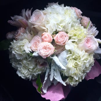 Wildflower - Beautiful arrangement by Wildflower. Blush and cream arrangement in a cylinder glass vase with a green leaf. - Florists Near Me - Capistrano beach, California