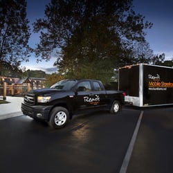 Read's Uniforms Mobile Services truck and trailer in front of the entrance to Read's Uniforms Asheville