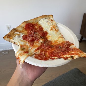 Rocky's Pizzeria - a slice of pizza on a paper plate - Pizza Near Me - New York, New York Rocky's Pizzeria - a slice of pizza on a paper plate - Pizza Near Me - New York, New York