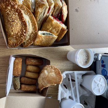 Pastelmania Bakery - An assortment of pastelitos, croquetas, and empanadas with cortadito and batido de mango. - Latin American Near Me - Miami, Florida