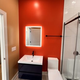 a bathroom with orange walls a bathroom with orange walls