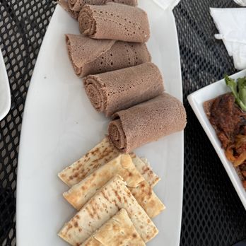 Gihon - Injera (top) and pita (bottom); These came with our entrees. - Ethiopian Near Me - San Diego, California Gihon - Injera (top) and pita (bottom); These came with our entrees. - Ethiopian Near Me - San Diego, California