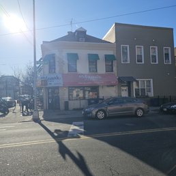 Outside across the street from the spot. Tiny but excellent pizza Outside across the street from the spot. Tiny but excellent pizza