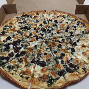Manny's Pizza House VI - Spinach pizza with olives. Crazy good! - Pizza Near Me - Port Orange, Florida