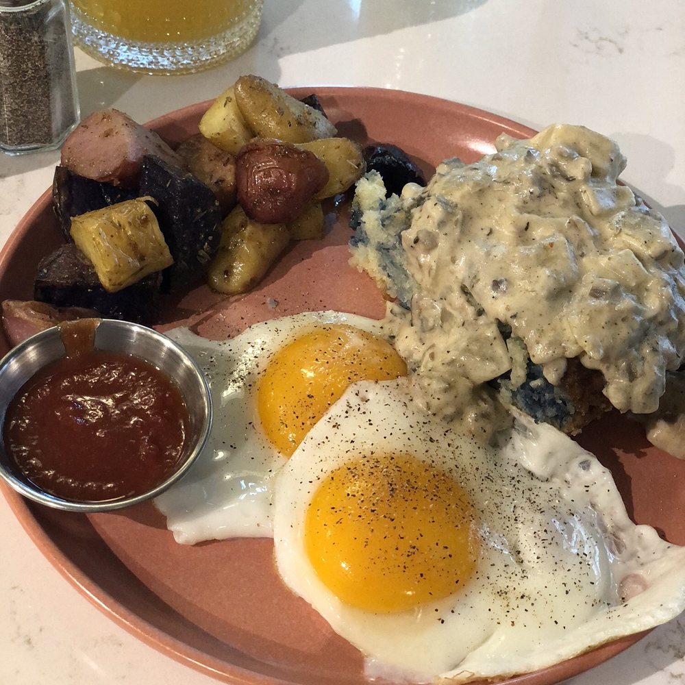 Rosemary potatoes, the most delicious ketchup I've ever had (made fresh here) with two eggs and biscuit with gravy. Rosemary potatoes, the most delicious ketchup I've ever had (made fresh here) with two eggs and biscuit with gravy.