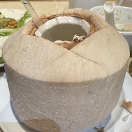 Coconut that arrived next to a bowl of rice when we asked if they had coconut rice. Coconut that arrived next to a bowl of rice when we asked if they had coconut rice.