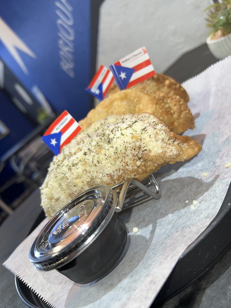 Melina’s Empanadas Logo
