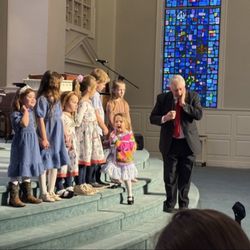 Calvary Baptist Church - Kids being taught by elderly man