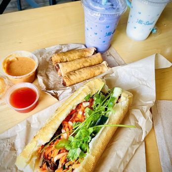 Mi-Sant Banh Mi - Bulgogi Beef Sandwich, Side of Veggie Egg Rolls with Peanut Sauce & Sweet n Sour, and Taro Root Tea (purple). - Sandwiches Near Me - Brooklyn Park, Minnesota Mi-Sant Banh Mi - Bulgogi Beef Sandwich, Side of Veggie Egg Rolls with Peanut Sauce & Sweet n Sour, and Taro Root Tea (purple). - Sandwiches Near Me - Brooklyn Park, Minnesota
